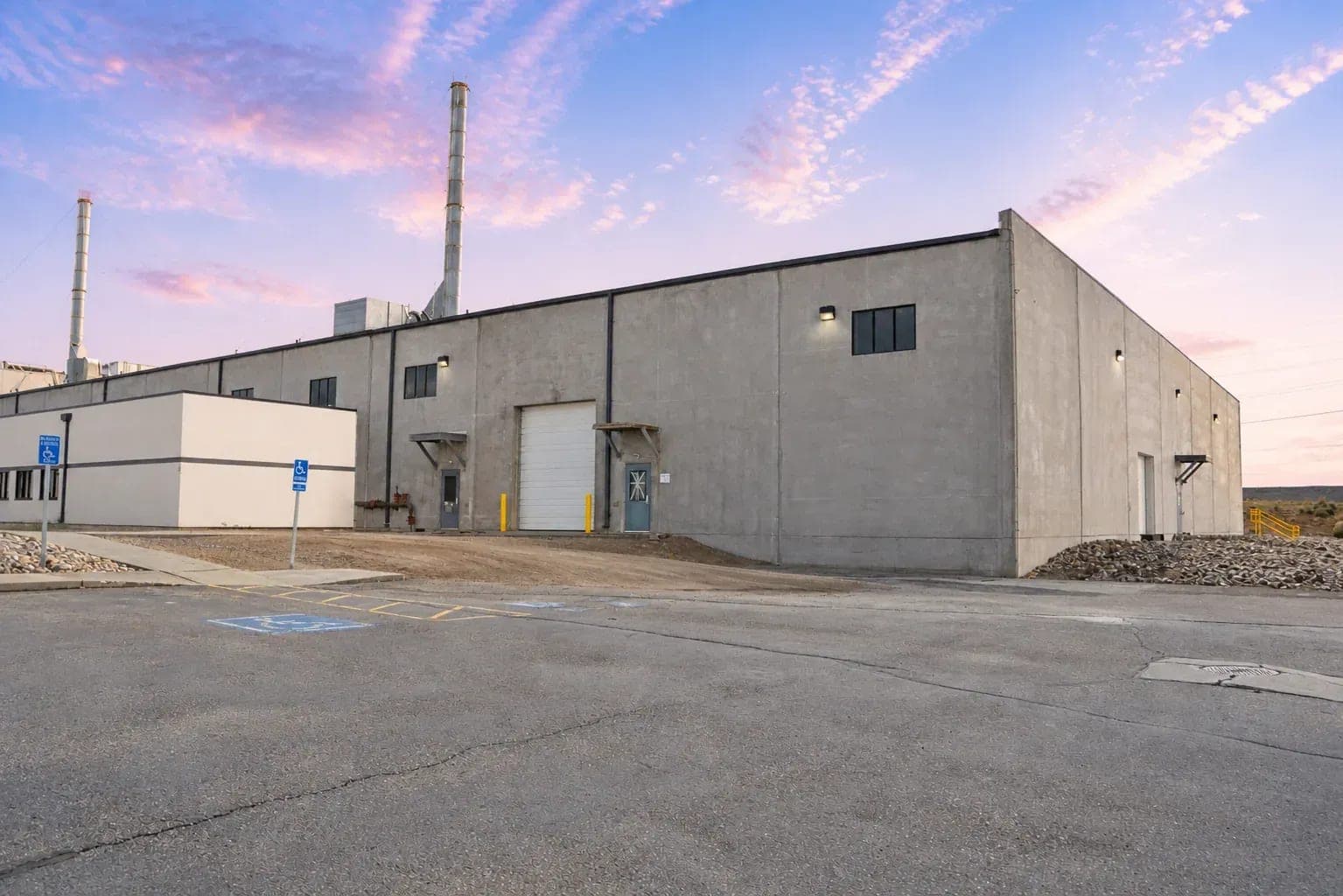 The Ally Labs manufacturing facility in Evanston, Wyoming at dusk.